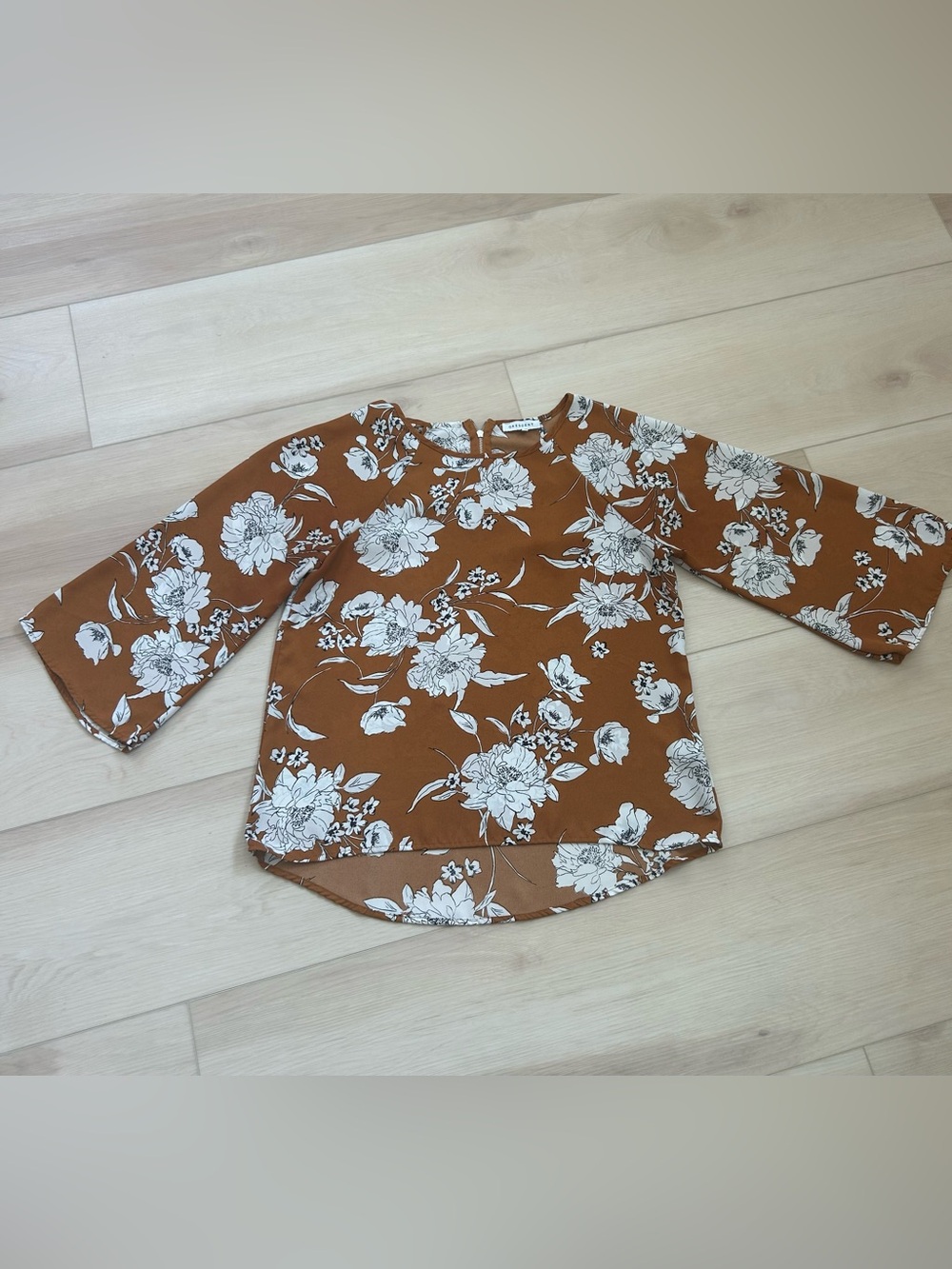 Womens floral blouse with 3/4 sleeves and a high-low hem